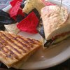 Half a grilled cheese and half a grilled veggie sandwich.